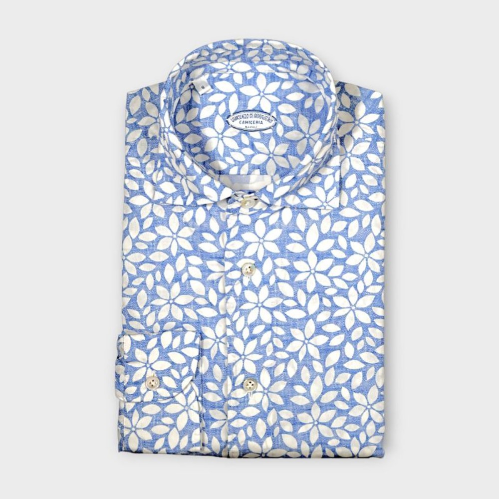 Immagine di Camicia in cotone azzurra con fantasia floreale bianca